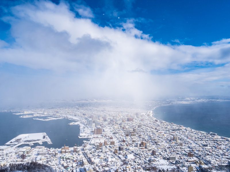 Beautiful landscape and cityscape from Mountain Hakodate for look around city skyline building and architecture with blue sky white cloud